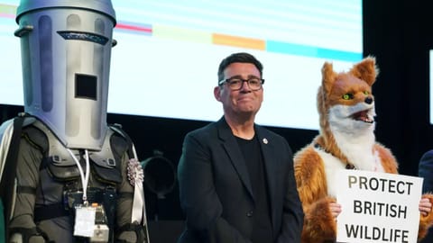Labour party's Andy Burnham stands beside candidate Count Binface, left, and a candidate for Protect British Wildlife after winning the Makerfield by-election, paving the way for a leadership challenge against Prime Minister Sir Keir Starmer. in Wigan, England