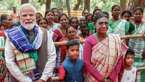 President Droupadi Murmu and Prime Minister Narendra Modi during their visit to the sacred groves Santhali Jahera and Ho Jahera, at Pahadpur