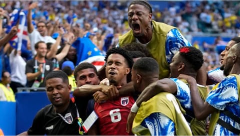 Cape Verde's Kevin Pina, center, celebrates with teammates after scoring the opening goal during the World Cup Group H soccer match between Uruguay and Cape Verde in Miami Gardens
