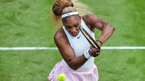 Serena Williams of the US returns the ball as she and Czech Republic's Karolina Muchova play during their round of 16 doubles match against New Zealand's Erin Routliffe and Mexico's Giuliana Olmo