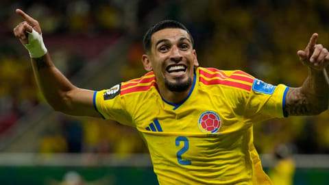 Colombia's Daniel Muñoz celebrates after scoring his goal during the World Cup Group K Soccer match between Colombia and Congo