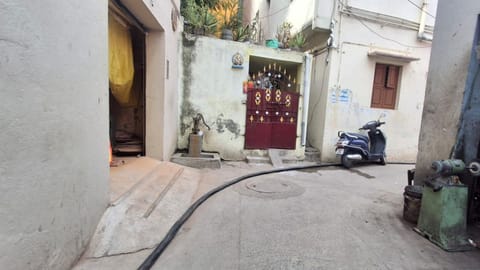 Power cable has been laid on road surface posing a potential danger to pedestrians and motorists on School Street at West Jafferkhanpet