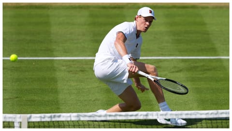 Jannik Sinner of Italy returns during a tennis exhibition match against Cameron Norrie of Great Britain at the Hurlingham Tennis Club in London.