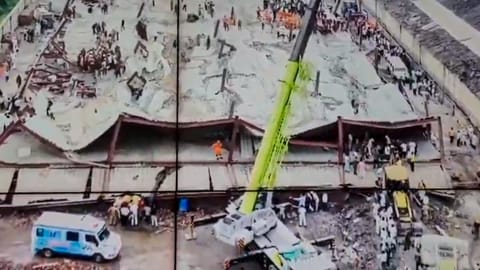 Officials conduct a rescue operation after a three-storey under-construction warehouse collapsed at Taratala area, in Kolkata