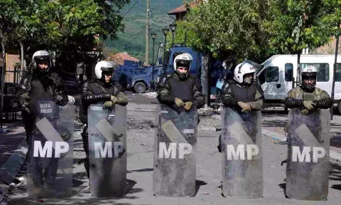 Polish Kosovo Force (KFOR) soldiers stand guard at a municipal office in Zvecan, Kosovo 