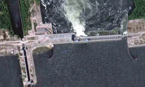 A satellite image shows a close-up view of Nova Kakhovka dam and hydroelectric power facility, Ukraine