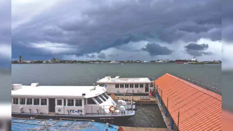 Dark clouds cover Kochi skyline Thursday