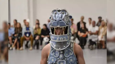 A model wears a creation as part of the Jeffrey Loverboy men's Spring Summer 2024 collection presented in Milan (Image: AP)