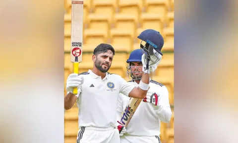 Dhruv Shorey celebrates scoring a ton