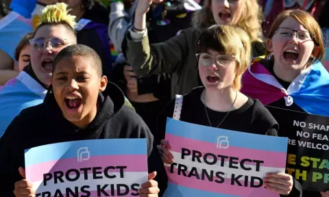  Protesters of Kentucky Senate Bill SB150, known as the Transgender Health Bill, cheer on speakers during a rally on the lawn of the Kentucky Capitol in Frankfort, Ky., March 29, 2023. A federal judge temporarily blocked Kentucky’s ban on gender-affirming care for transgender youths on Wednesday, June 28, taking the action shortly before the measure was set to take effect.(Photo: AP)