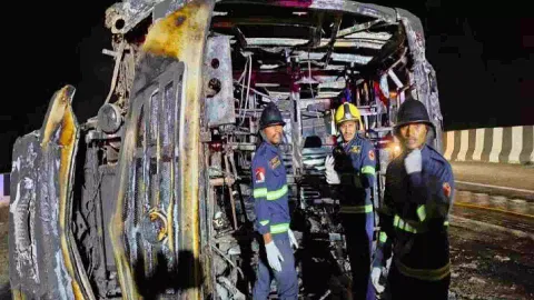 Rescue workers near the passenger bus which met with an accident (Photo: PTI)
