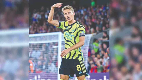 Odegaard celebrates scoring his second-half penalty