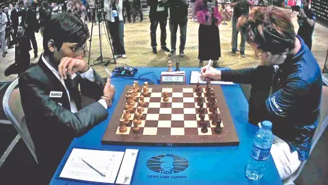 R Praggnanandhaa and Magnus Carlsen during the final match