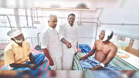 Injured fishermen being consoled by local leaders at the hospital on Wednesday