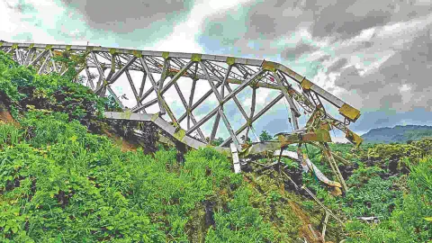 Locals at the site after an under-construction railway bridge at Sairang area collapsed in Mizoram