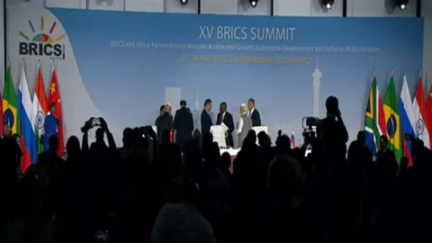 PM Narendra Modi and Chinese premier Xi Jinping shake hands at BRICS platform 