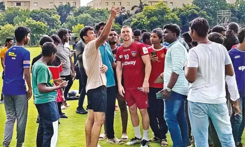 Connor Shields posing for pictures with fans