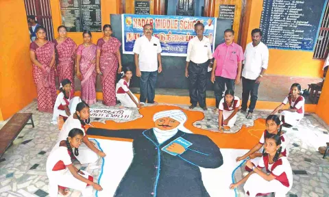 Students drawing rangoli of poet Mahakavi Subramania Bharathi at Nadar Middle School
in Kovilpatti, Thoothukudi on Monday