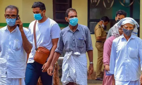People wear masks at a medical college after the Nipah virus alert in Kozhikode. (PTI) 