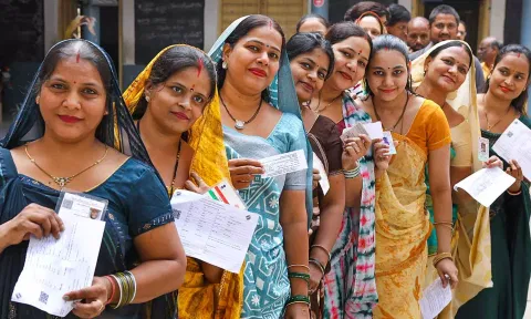 Women waiting in queue at a polling booth to cast their votes. (PTI)