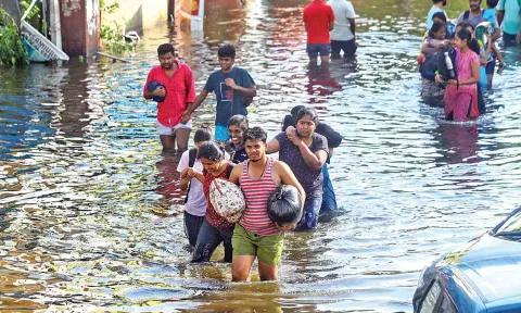 Residents shift to safer areas from rain-ravaged Thoraipakkam on Tuesday