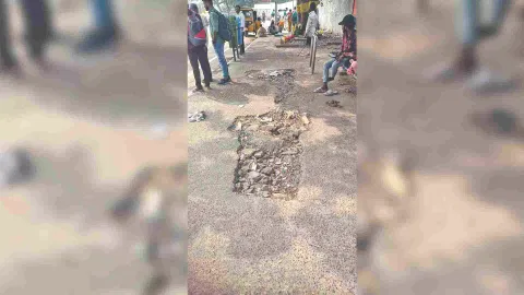Damaged pavement in front of the Egmore railway station bus stop