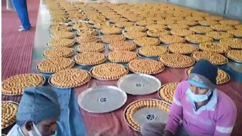 Artists from Varanasi & Gujarat make Laddu using desi ghee to offer Lord Ram during the upcoming Ram Temple 'Pran Pratishtha' ceremony. (ANI)