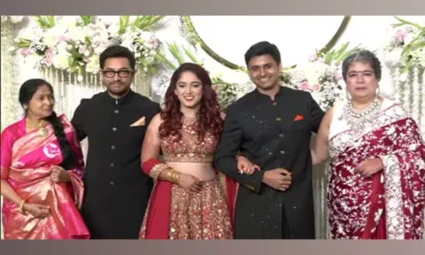 Aamir Khan poses with newlyweds Ira Khan, Nupur Shikhare at wedding reception