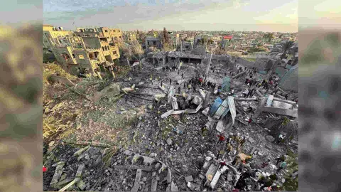 Palestinians inspect the site of an Israeli strike on a mosque (Reuters)