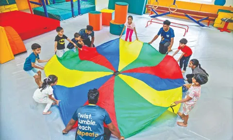 Children engaged in an activity at Tiny Tumbles