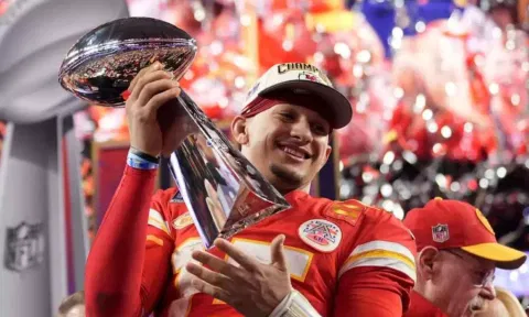 Kansas City Chiefs quarterback Patrick Mahomes celebrates with the trophy after the team’s win in overtime during the NFL Super Bowl 58 football game against the San Francisco 49ers on Sunday, Feb. 11, 2024, in Las Vegas. The Chiefs won 25-22. 