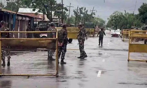 Police personnel fire tear gas at protesters in Imphal. (PTI)