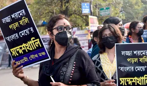 Members of Sangrami Joutha Mancha hold placards during a protest against Sandeshkhali case, in Kolkata (PTI) 