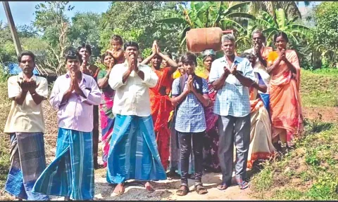 Periannanpatti residents, one seen with a cylinder on head, thank officials (not seen) who came to provide polio drops
