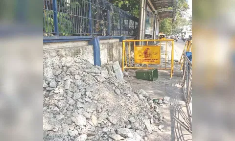 Debris dumped on footpath of EVR Periyar Salai