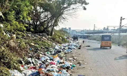 Waste and debris accumulated on the road adjacent to the Pallavaram Railway Station