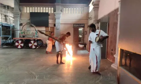 Temple archakas preparing for Deeparadhana at Samayapuram Mariamman temple on Monday