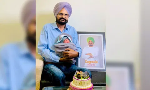 Balkaur Singh with newly born child. (Balkaur Singh/Facebook)