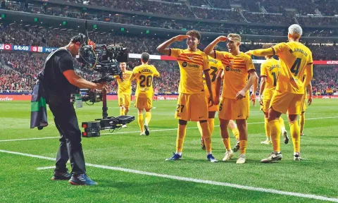 Lamine Yamal (L) and Fermin celebrate Barcelona’s third goal