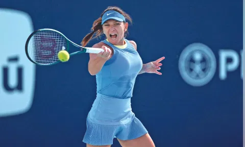 Simona Halep returns a shot during her match