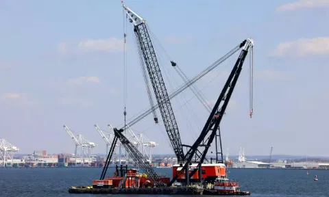  Large cranes in the Patapsco River near the collapsed Francis Scott Key Bridge in Baltimore (Reuters)