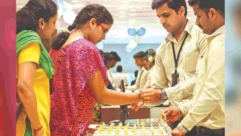 People buying gold jewellery at a shop in Chennai 