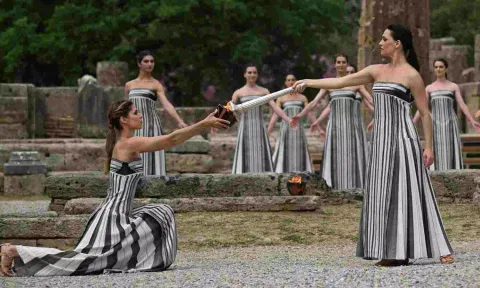 Greek actress Mary Mina, playing the role of High Priestess, carries the torch during the Olympic Flame lighting ceremony for the Paris 2024 Olympics. 