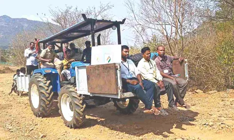 For the first time, polling personnel taking election materials on a tractor, instead of donkeys, to hill villages in Dharmapuri district on Thursday