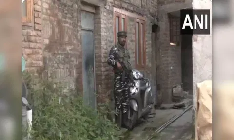 NIA raids nine places in J-K in terror case (ANI)