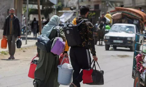 People flee the eastern parts of Rafah after the Israeli military began evacuating Palestinian civilians (Reuters)