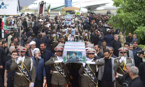 Army members carry the coffins of President Ebrahim Raisi and his companions who were killed in a helicopter crash, during a funeral ceremony at Mehrabad airport in Tehran, Iran. (Photo: AP)