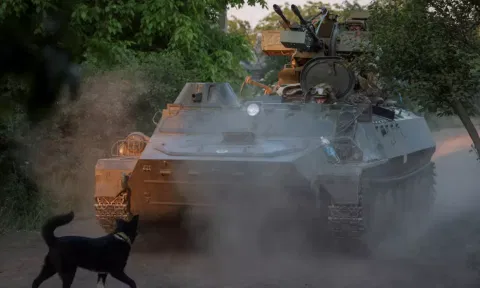 Ukrainian personnel in an armoured carrier after Russia's attack on Ukraine (Reuters)