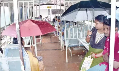  Commuters kept their umbrellas open inside the bus in Nagercoil 