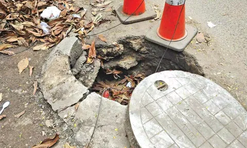 Raised and damaged drain cover on re-laid Patel Road in Perambur